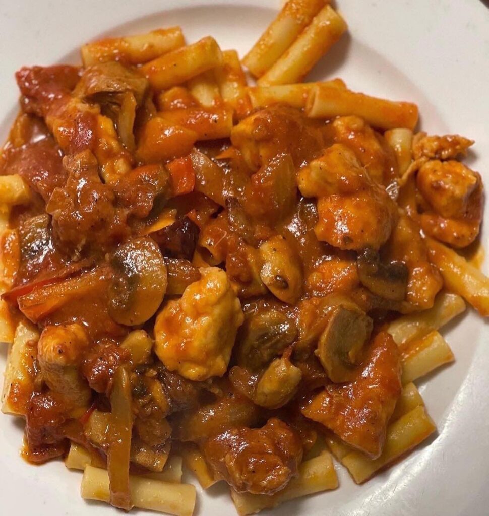 Ziti with chicken, sausage, peppers and mushrooms in tomato sauce