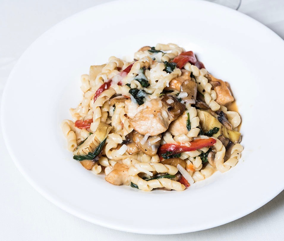 Pasta with chicken, vegetables and shaved cheese